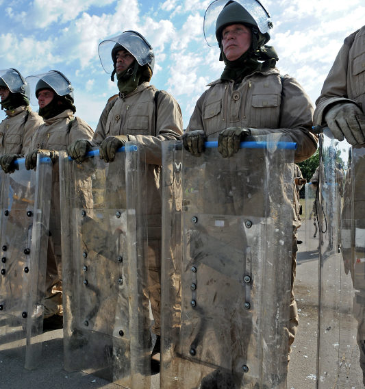 Pictured are members of 2 LANCS acting as civilian rioters facing the reserve soldiers from 4 LANCS during Public Order drills. 4th Battalion Duke of Lancaster's Regt. are now going through the final stages of their validation training in readiness to deploy to Cyprus on Operation TOSCA. Op TOSCA is a six-month long mission to maintain the status quo, peace and security along the buffer zone or Green Line which separates the Turkish north from the Greek south in Cyprus which was annexed in 1974.