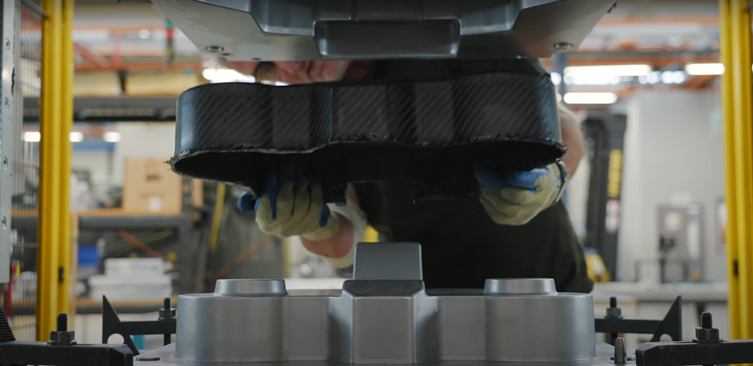 Image: PENATXIA - A carbon fibre composite component being removed from a 2-part press mould.